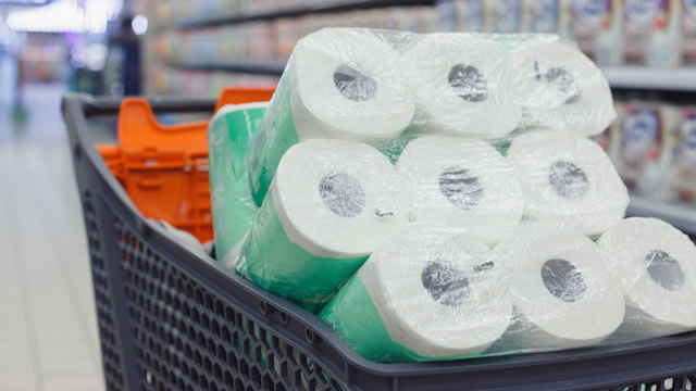 Shopping trolley full of toilet paper packs